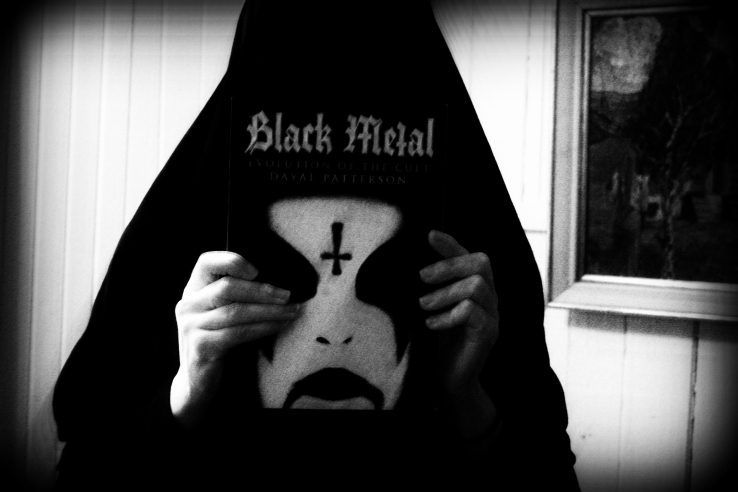 Holding my copy of Black Metal: Evolution of the Cult. 