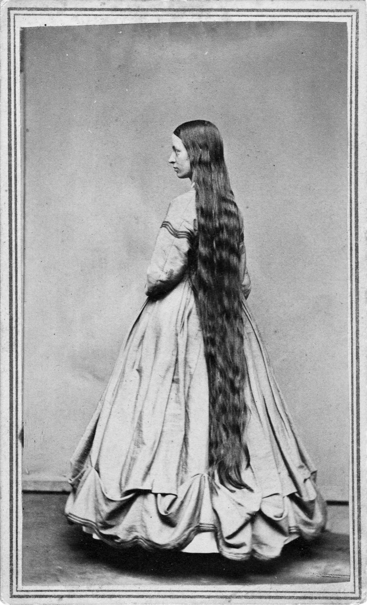 UNITED STATES - CIRCA 1865:  A woman poses to show her long hair in a studio around 1865 in an unknown location.  (Photo Reproduction by Transcendental Graphics/Getty Images) *** Local Caption ***